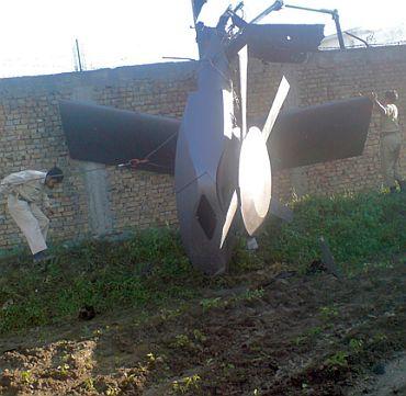 Part of a damaged helicopter is seen lying near the compound after US Navy SEAL commandos killed Al Qaeda leader Osama bin Laden in Abbottabad