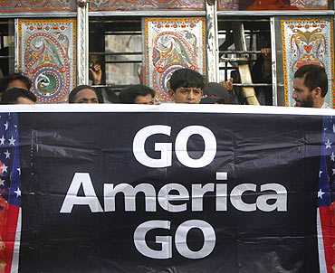 Supporters of Jamaat-e-Islami hold a banner during an anti-American rally through the streets of Karachi after Laden's death