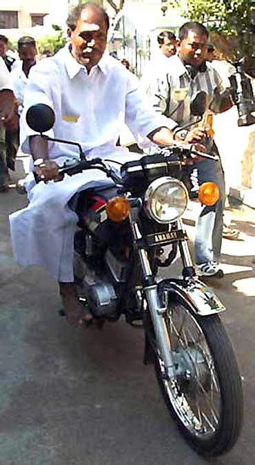 All India NR Congress chief N Rangaswamy on a motorbike in Puducherry