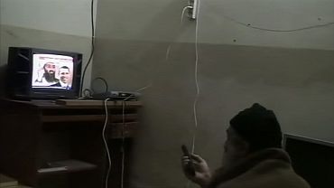Osama bin Laden is shown watching himself on television, with U.S. President Barack Obama also on screen, in this video frame grab released by the Pentagon