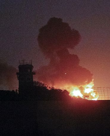 A plume of smoke rises after an explosion at the Mehran naval aviation base which was attacked by militants in Karachi