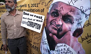 A supporter of social activist Hazare holds a placard during a campaign against corruption in Chandigarh