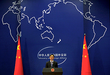 China's Foreign Ministry spokesman Liu Weimin listens to a question during a news conference in Beijing