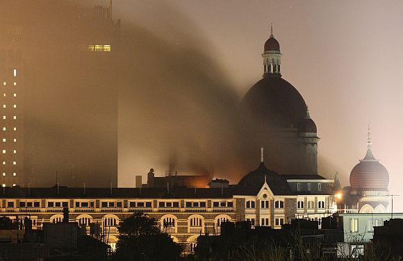 Flames rise from the Taj Mahal hotel, early on November 27, 2008, after the terrorists attacked the iconic Mumbai hotel.
