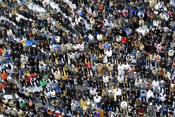 Egyptian protesters pray during a march in Tahrir Square in Cairo