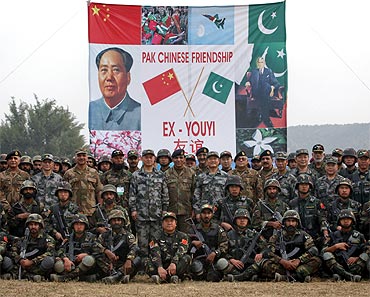 Pakistani Army Chief General Ashfaq Kayani and Chinese General Hou Shusen, deputy chief of general staff of the Chinese People's Liberation Army, pose for a group photo after joint military exercises in Jhelum, in Pakistan's Punjab province