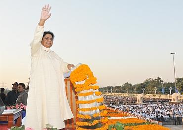 Mayawati waves to crowds after the inaguration of the Dalit memorial in Noida