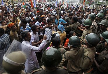 Demonstrators affected by the construction of barbed-wire fencing along Indo-Bangla border clash with policemen in Agartala in May 2011