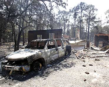 Wildfires swept through an area near Bastrop, Texas destroying vehicles and houses