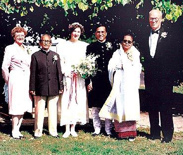 Nancy Yambem as a bride with husband Jupiter and their families