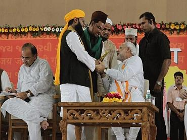 Muslims greet Gujarat Chief Minister Narendra Modi during his sadbhavana fast in 2011.