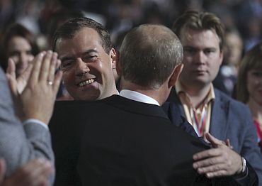 Medvedev greets Prime Minister Putin during the United Russia congress in Moscow
