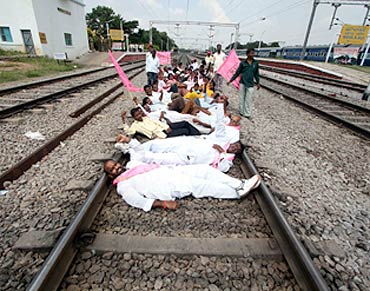 Pro-Telangana activists sleep on railway tracks during the rail roko agitation near Hyderabad on Saturday