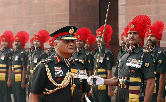 Army Chief General Singh inspects a guard of honour in New Delhi