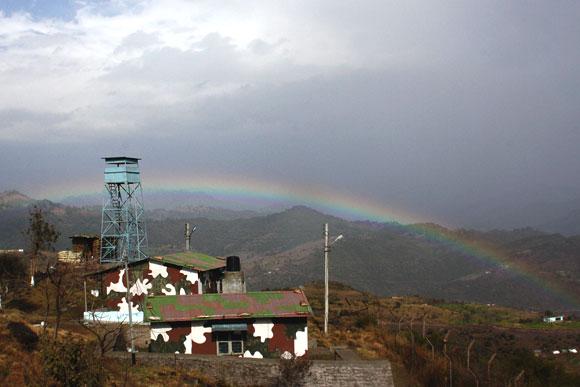 A Defence Security Corps trooper stands guard at an Indian Air Force radar station in Jammu and Kashmir