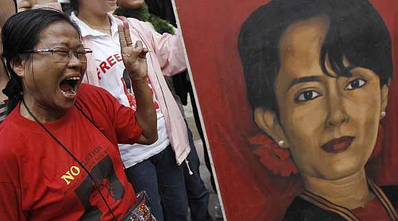 A supporter of Suu Kyi celebrates in New Delhi