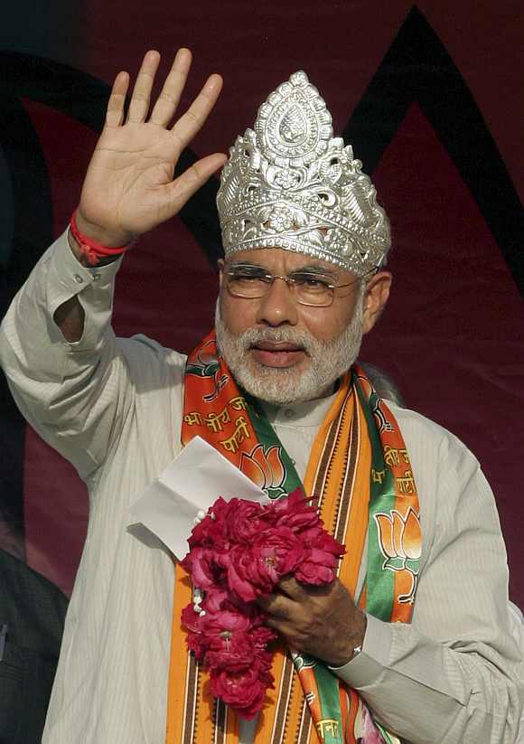 Narendra Modi waves to his party's supporters