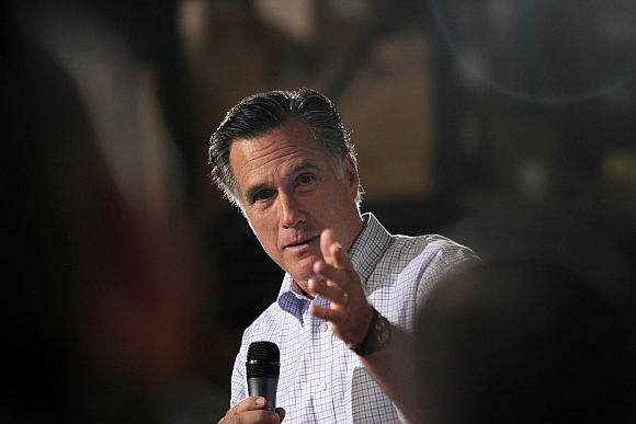 Republican presidential candidate Romney speaks to supporters at a town hall meeting in Milwaukee
