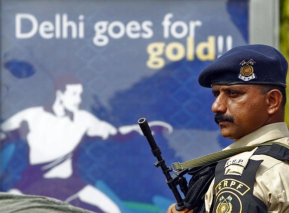 A CRPF personnel stands guard outside the Jawaharlal Nehru Stadium in New Delhi