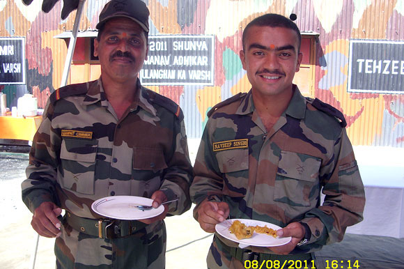 Lieutenant Navdeep, right, at his unit, 12 days before he was martyred