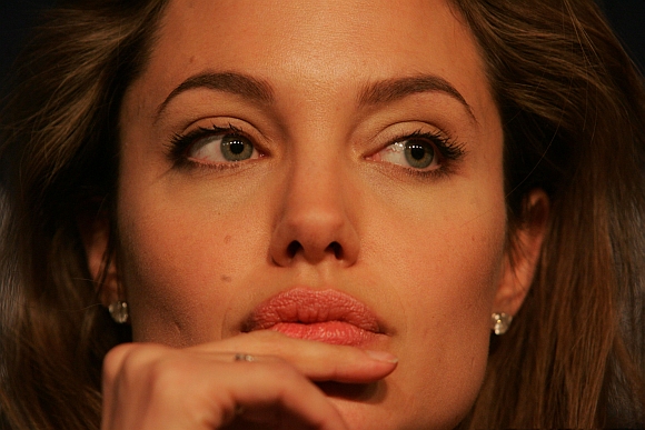 Angelina Jolie looks on during a news conference at the World Economic Forum in Davos