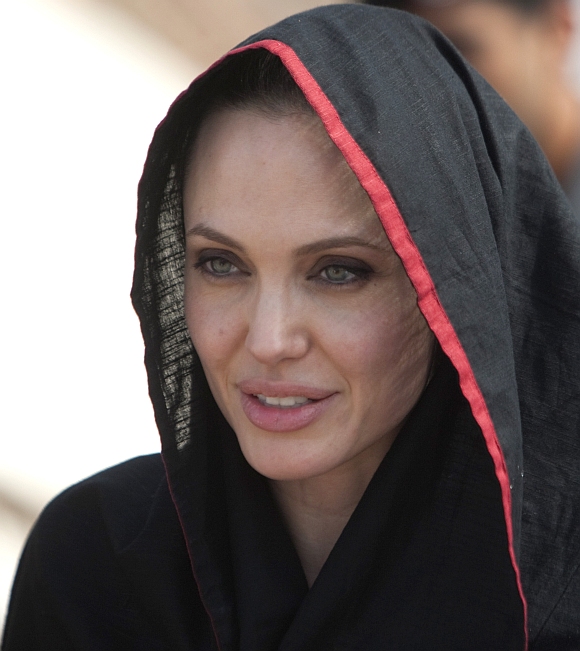 Angelina Jolie wears a headscarf as she arrives at the Jalozai flood victim relief camp during her visit to flood affected areas and relief camps supported by the UNHCR in Pakistan's northwest Khyber-Pakhtunkhwa province