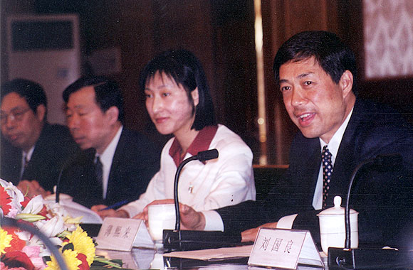 Bo Xilai, then the Mayor of Dalian, in his office. The lady is his interpreter.