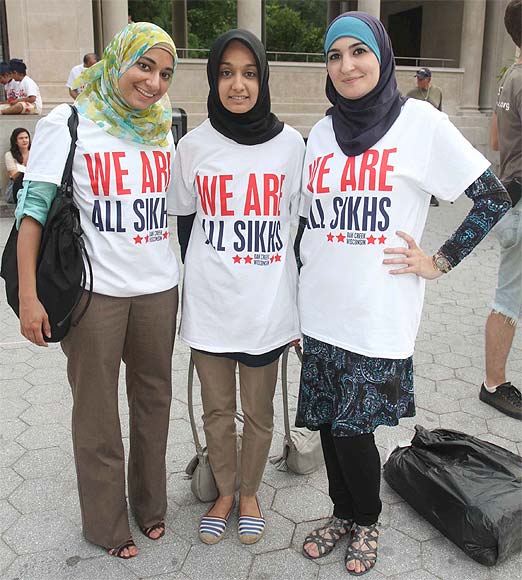 Muslim girls participate in the vigil held in New York to condemn the  Wisconsin shooting