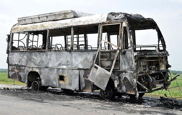 A mob torches a bus in violence-hit Assam