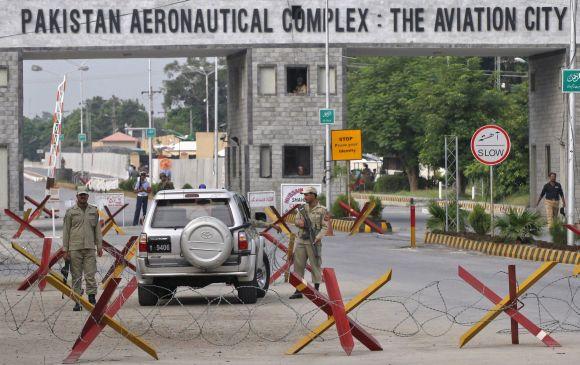 Pakistan army soldiers stand guard at the Minhas base at Kamra in Pakistan