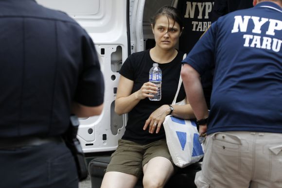 A woman identified as a victim is treated at the scene of a shooting near the Empire State Building in New York