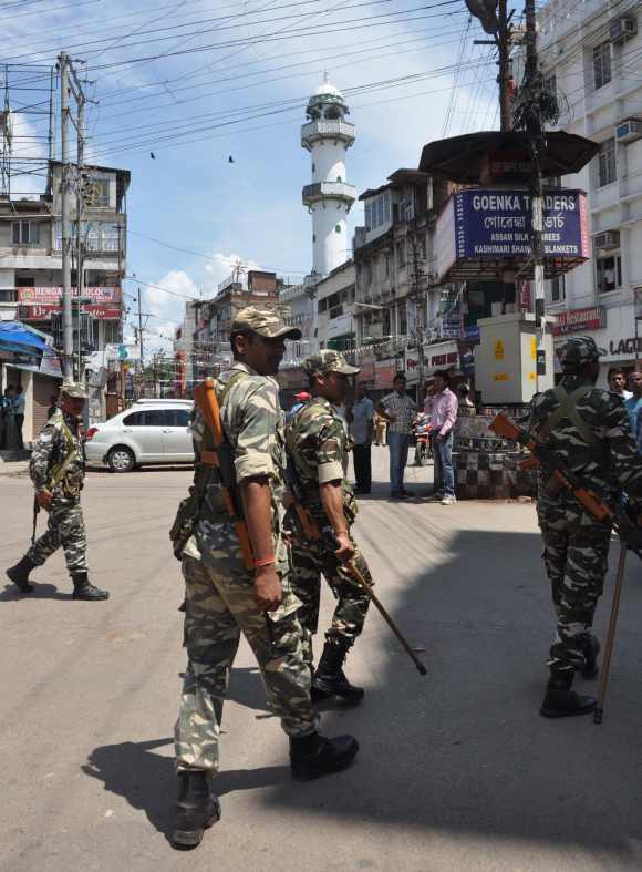 Army personnel patrol disturbed areas in Kokrajhar district in Assam