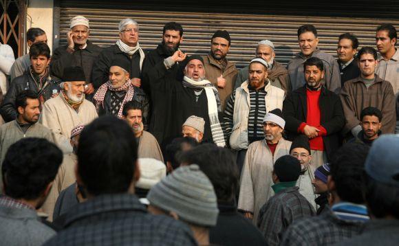 Members of Shia and Sunni communities hold a peace march to ease tension in curfew-bound parts of Srinagar on Tuesday