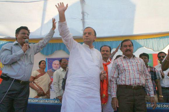 Jaitley arrives at a campaign rally in Kapadvanj, Gujarat