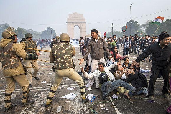 Delhi Police lathi charge to disperse protestors during a protest against the government's reaction to recent rape incidents in India, in front of India Gate