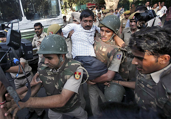 Arvind Kejriwal being detained by the police during a protest march in New Delhi