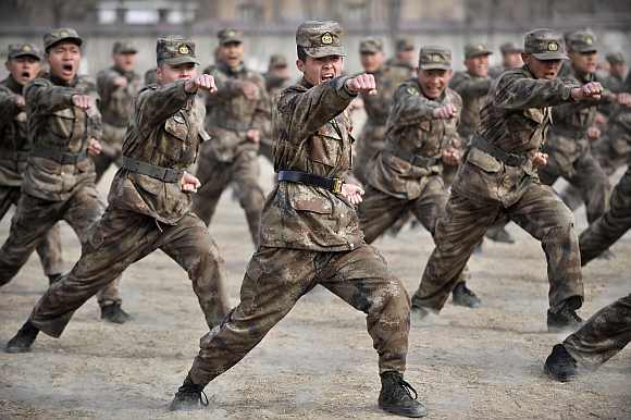 Recruits from the People's Liberation Army attend a training session at a military base in Yinchuan