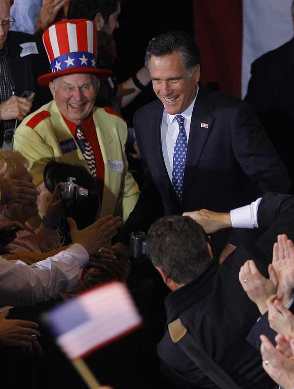 Romney is greeted by supporters at Florida primary night rally in Tampa