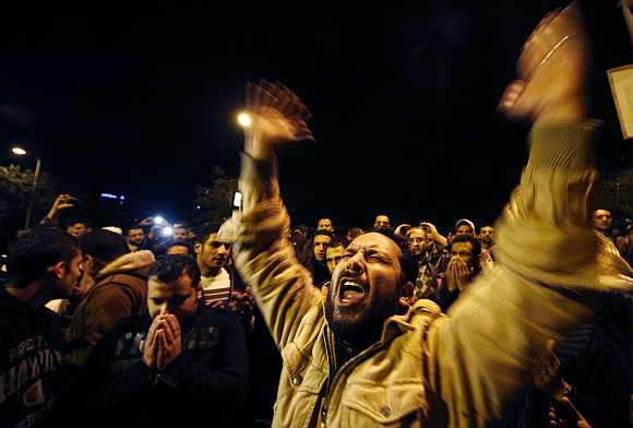 A man reacts at Ramses metro station in Cairo after the arrival of people wounded in clashes in Port Said stadium