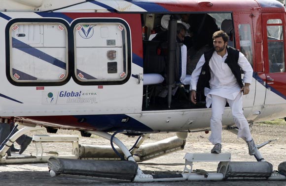 Rahul Gandhi hops out of a helicopter during his election campaign in UP