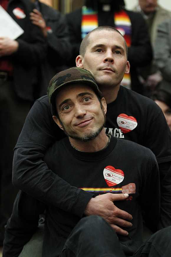 Frank and his husband Joe Kapley-Alfano embrace during a press conference about the ruling of Proposition 8 banning gay marriage outside the Ninth Circuit Courthouse in San Francisco