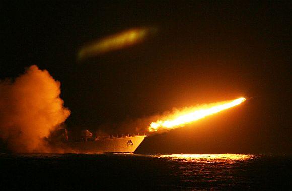 A surface-to-air missile is fired from a naval warship to intercept a surface-to-surface missile