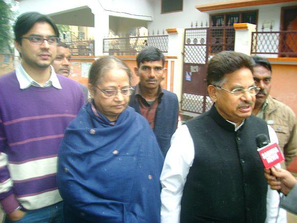 Congress leader Pannalal Punia speaks to the media as he arrives to cast his vote along with his family at a polling booth in Barabanki on Wednesday