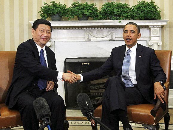 US President Barack Obama shakes hands with China's Vice President Xi Jinping in the Oval Office of the White House in Washington, February 14