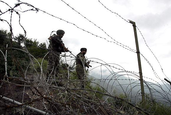 Indian soldiers patrol near the Line of Control