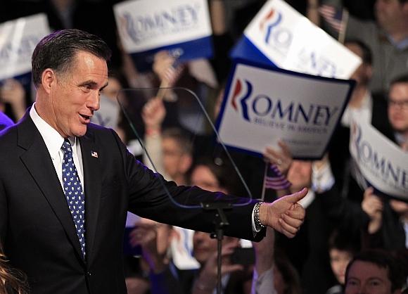 Republican presidential candidate andf former Massachusetts Governor Mitt Romney greets supporters at his New Hampshire primary night rally in Manchester, New Hampshire