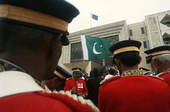 Members of a police band gather outside the Supreme Court