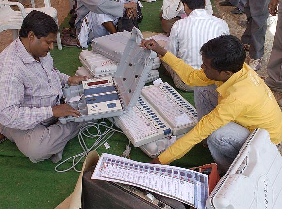 A polling officer checks EVMs in Allahabad.