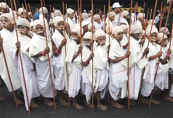 Children dressed as Mahatma Gandhi at a peace march in Kolkata.