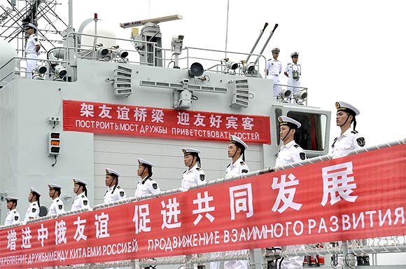 Sailors line up onboard a Chinese warship